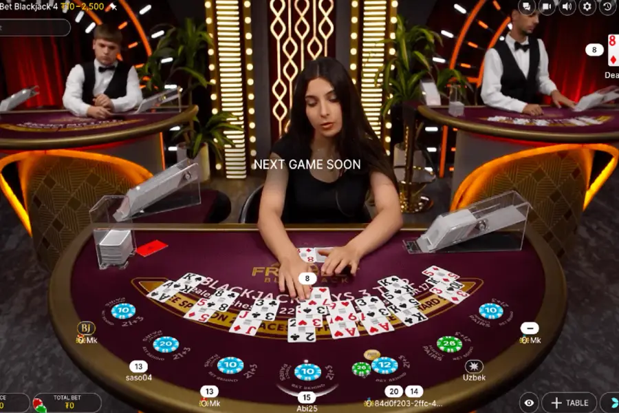 Multiple players decide whether to hit or stand in a game of Free Bet Blackjack on CoinPoker.